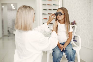 Child in a glasses store check his eyes