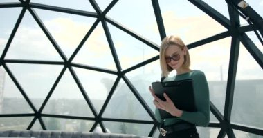 Business European woman holding documents in hands