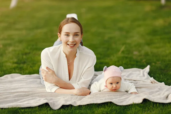 Family spend time in a summer garden — Stock Photo, Image