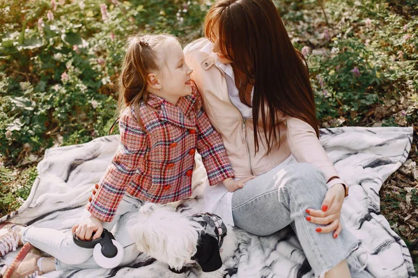 Mother with daughter in a spring forest with dog — Stock Photo, Image