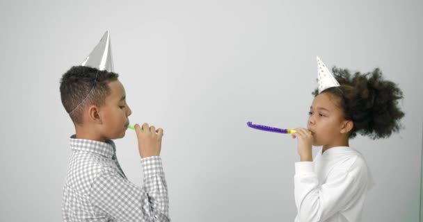 Black kids celebrating birthday over white background — Stockvideo