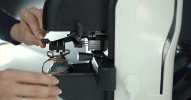 Close view of the process of making individual glasses in the device