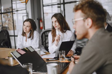 Colleagues hold a meeting in the office.