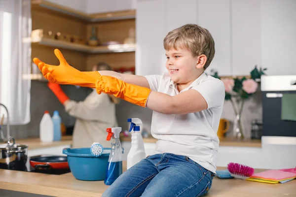 Blonde Boy Adult Woman Cleaning Kitchen Wearing Orange Gloves Caucasian — Stock Photo, Image