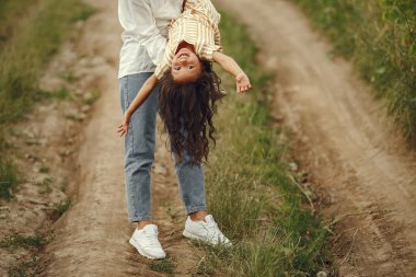 Family in a summer field. Sensual photo. Cute little girl.