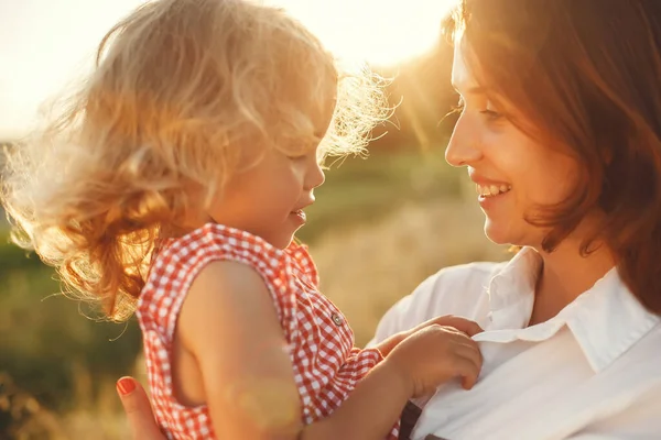 Family in a summer field. Sensual photo. Cute little girl.