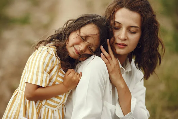 Family in a summer field. Sensual photo. Cute little girl.