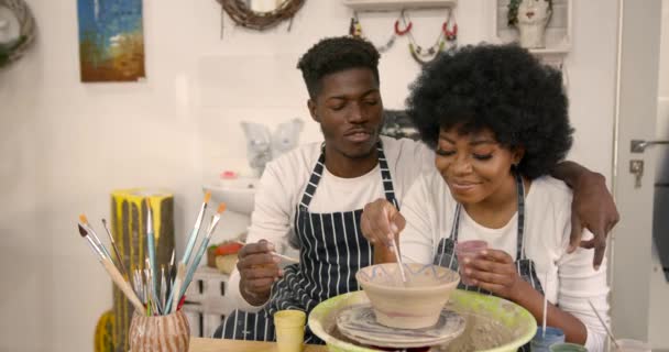 Couple Smiling While Doing Creative Painting Bowls Pottery Workshop Pottering — Stockvideo