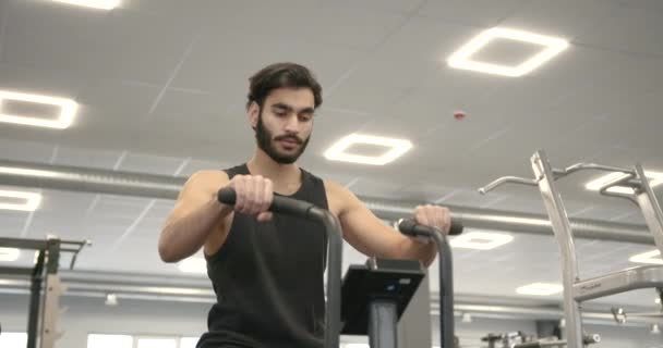 Young Athlete Beard Pedals Simulator Modern Light Gym Training Concept — Stockvideo