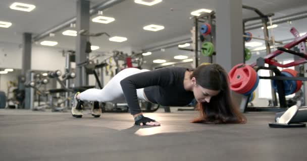 Attractive Girl Long Dark Hair Gloves Squeezes Floor Modern Gym — Video