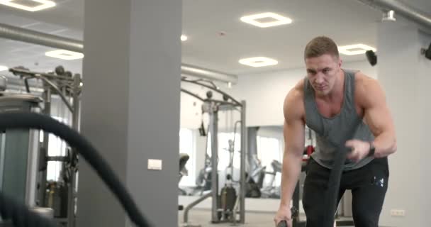 Athletic Guy Focuses Fitness Training Ropes Gym Functional Mens Training — Stockvideo