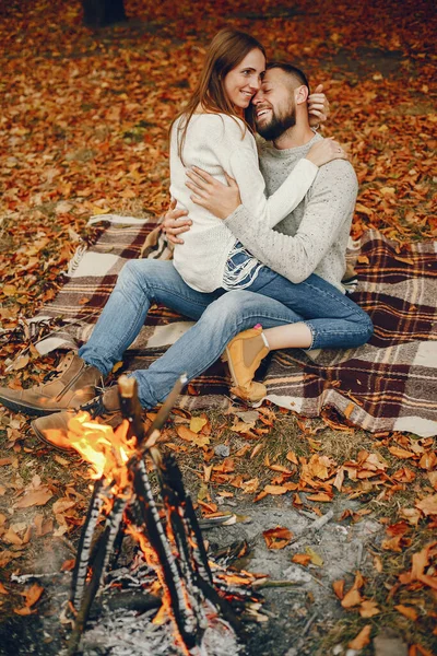 Couple in a park. Family in a golden forest. Man with a beard