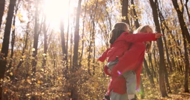 Young Mother Red Jacket Holds Her Daughter Her Arms Soak — Stock video