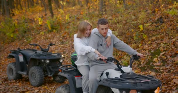 Young Couple Costumes Sitting Atv Girl Guy Hugs Him While — Vídeo de Stock