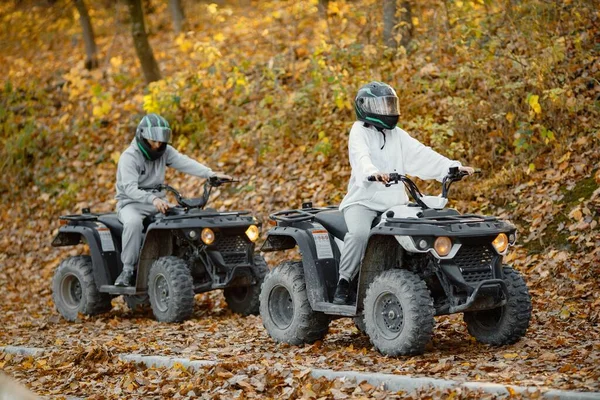 Young Caucasian Man Woman Riding Atv Quad Bikes Autumn Forest — Zdjęcie stockowe