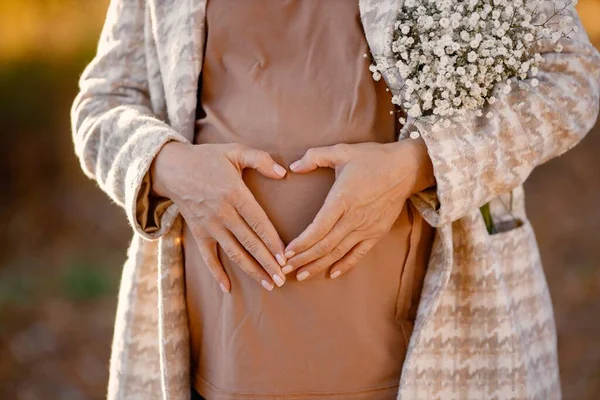 Close Expecting Pregnant Woman Wearing Brown Shirt Beige Jacket Holding — Fotografie, imagine de stoc