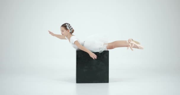 Girl White Tutu Stretching White Studio She Perfoeming Black Cube — Stock Video