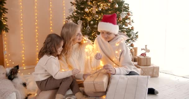 Young Family Sitting Floor Christmas Decorated Room Happy Parents Daughter — Stock Video