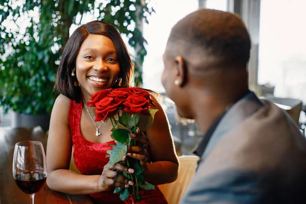 Couple Enjoying Day Out Restaurant Black Man Gifted Bouquet Red — Stock Photo, Image