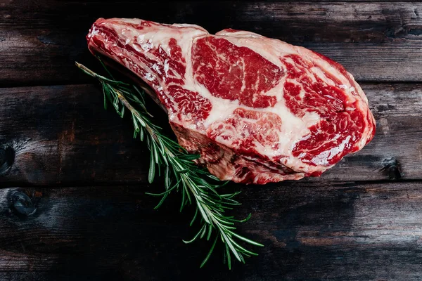 steak on dark wooden background pork beef