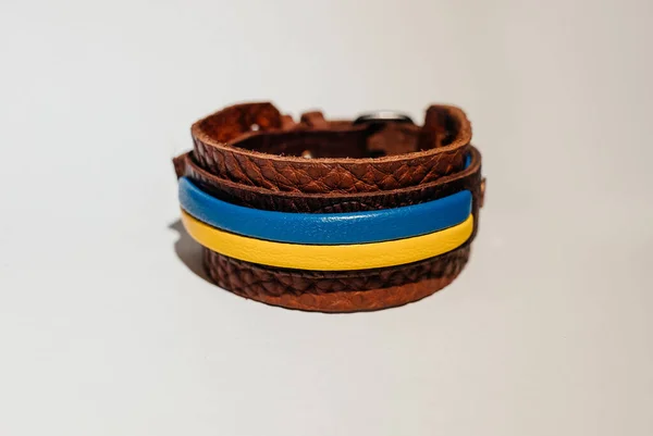 brown leather bracelet with blue and yellow leather Ukrainian flag