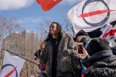 Feb 6, 2022 - Toronto Anti Vax protest at Queens Park. Trucker convoy protesters gather in Queen's Park, Toronto for the second consecutive weekend in solidarity with anti-mandate demonstrations.  clipart