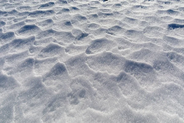 Snow Rippled Wind Creates Small Reliefs Surface Ground Mountains Background — Zdjęcie stockowe