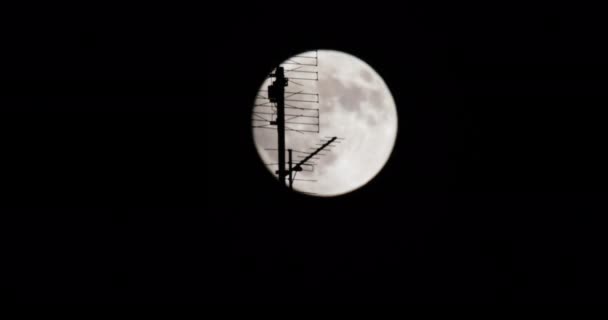 Full Moon Night Moon Passes Television Antenna Foreground — Stock video