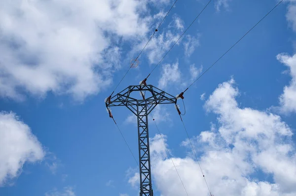 stock image power line tower with blue sky background and some cloud, landscape