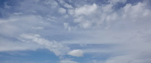 Abstract image of blurred sky. Blue sky background with cumulus clouds