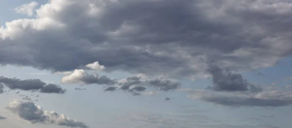 Dramatic black cloud before rainy. Beautiful cloudscape over horizon, sky