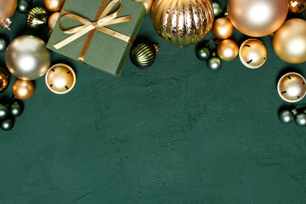 Christmas green background with golden decoration, holiday festive frame, copy space