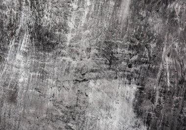 Yumuşak odaklı gri ve siyah duvar, arka planda çizikler var..