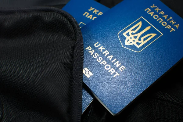 Ukrainian biometric passport id to travel the Europe without visas on the backpack. Inscription in Ukrainian 