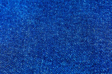 Mavi hippi kot pantolon kumaşı. Denim Kumaş dokusu arka planı. Doğal kumaşlar tekstil.