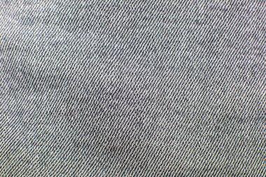 Retro Gray hippi kot pantolon kumaşı. Denim Kumaş dokusu arka planı. Doğal kumaşlar tekstil.