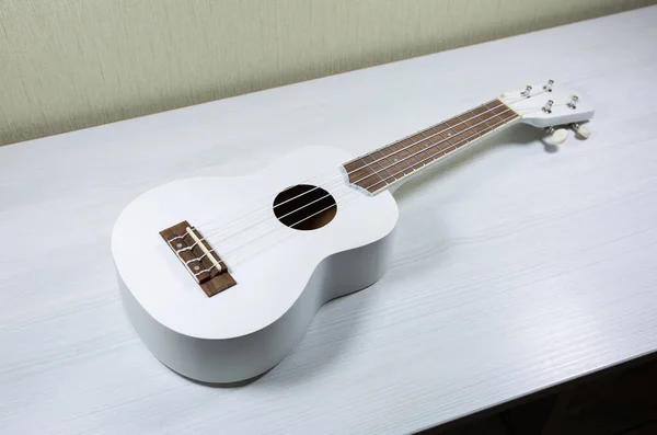 White Colored Wooden Ukulele Guitar White Wooden Background Hawaiian Four — Photo