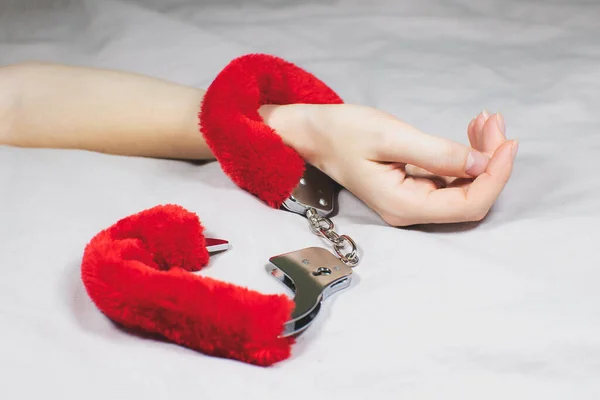 Woman Wearing Red Sexy Fluffy Handcuffs Her Wrists Bed — Stock Fotó