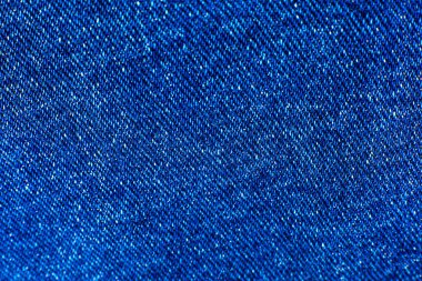 Mavi hippi kot pantolon kumaşı. Denim Kumaş dokusu arka planı. Doğal kumaşlar tekstil.