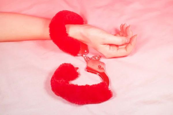 Woman Wearing Red Sexy Fluffy Handcuffs Her Wrists Bed — Zdjęcie stockowe
