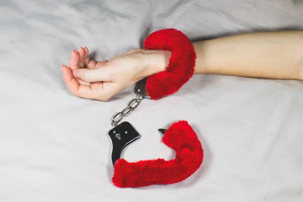 Woman Wearing Red Sexy Fluffy Handcuffs Her Wrists Bed — Stock Fotó
