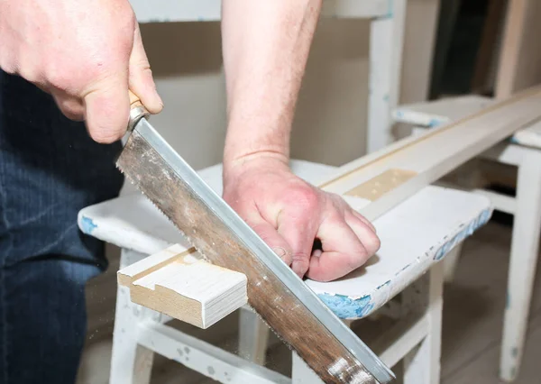 Man Installing Doors Carpenter Sawing Wooden Plank Repair Works Maintenance — стоковое фото