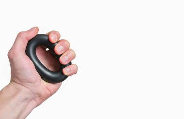 Expander isolated on white background. Man is holding in the hand grip strengthener.  Sporty wrist builder for everyday trainings.