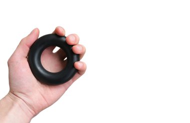 Expander isolated on white background. Man is holding in the hand grip strengthener.  Sporty wrist builder for everyday trainings.