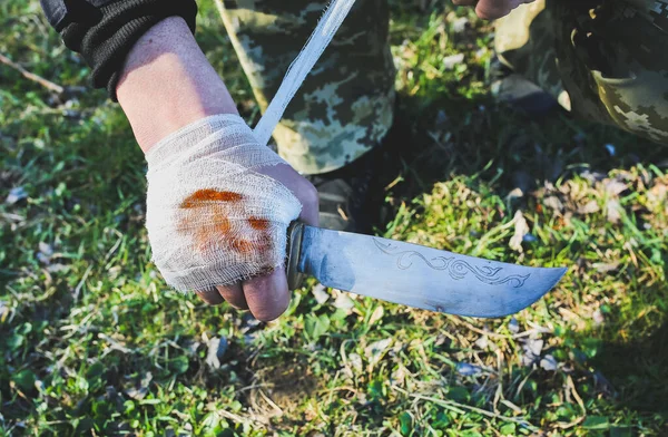 Man Putting Bandage Bleeding Wound Injured Hand Knife Grass Tourist — 스톡 사진