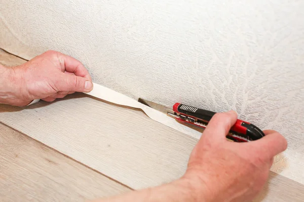 Man Cutting Wallpaper Maintenance Repair Works Renovation Flat Restoration Indoors —  Fotos de Stock