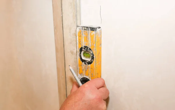 Man Holding Spirit Level Hands Hanging Wallpapers Maintenance Repair Works — Fotografia de Stock