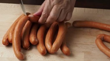 Pork sausages on the wooden cutting board