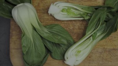 Endives on a wooden cutting board (Cichorium intybus). Fresh chicories