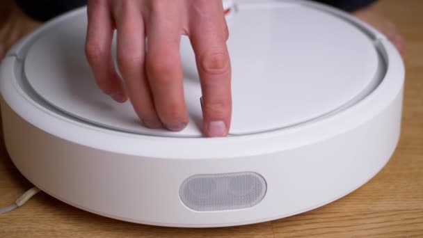 Male Hands Pulls Out the Dust Container from Automatic Robot Vacuum. Close up — Stock Video